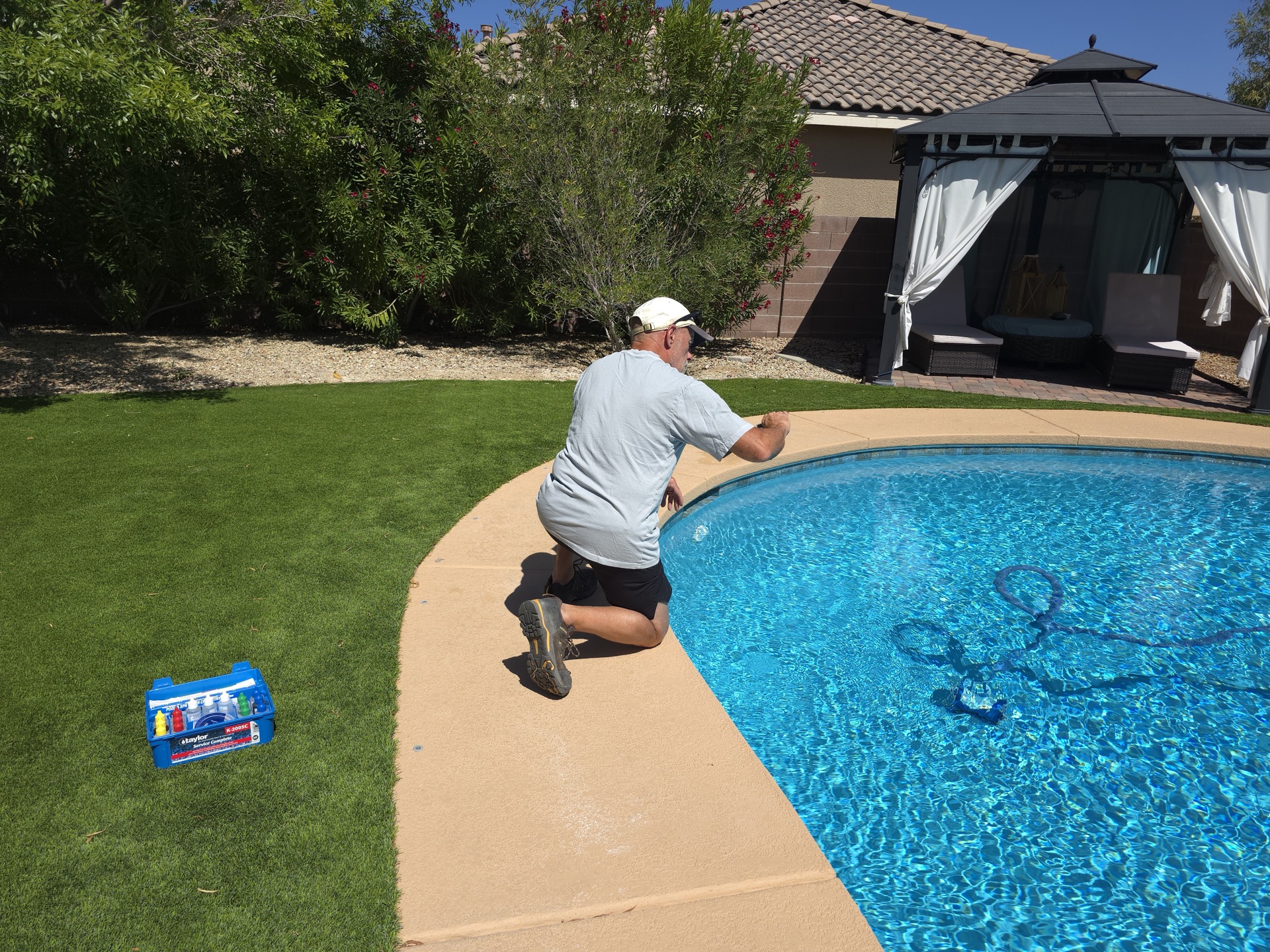 Taylor K-2006 pool chemistry test kit open poolside during a service visit