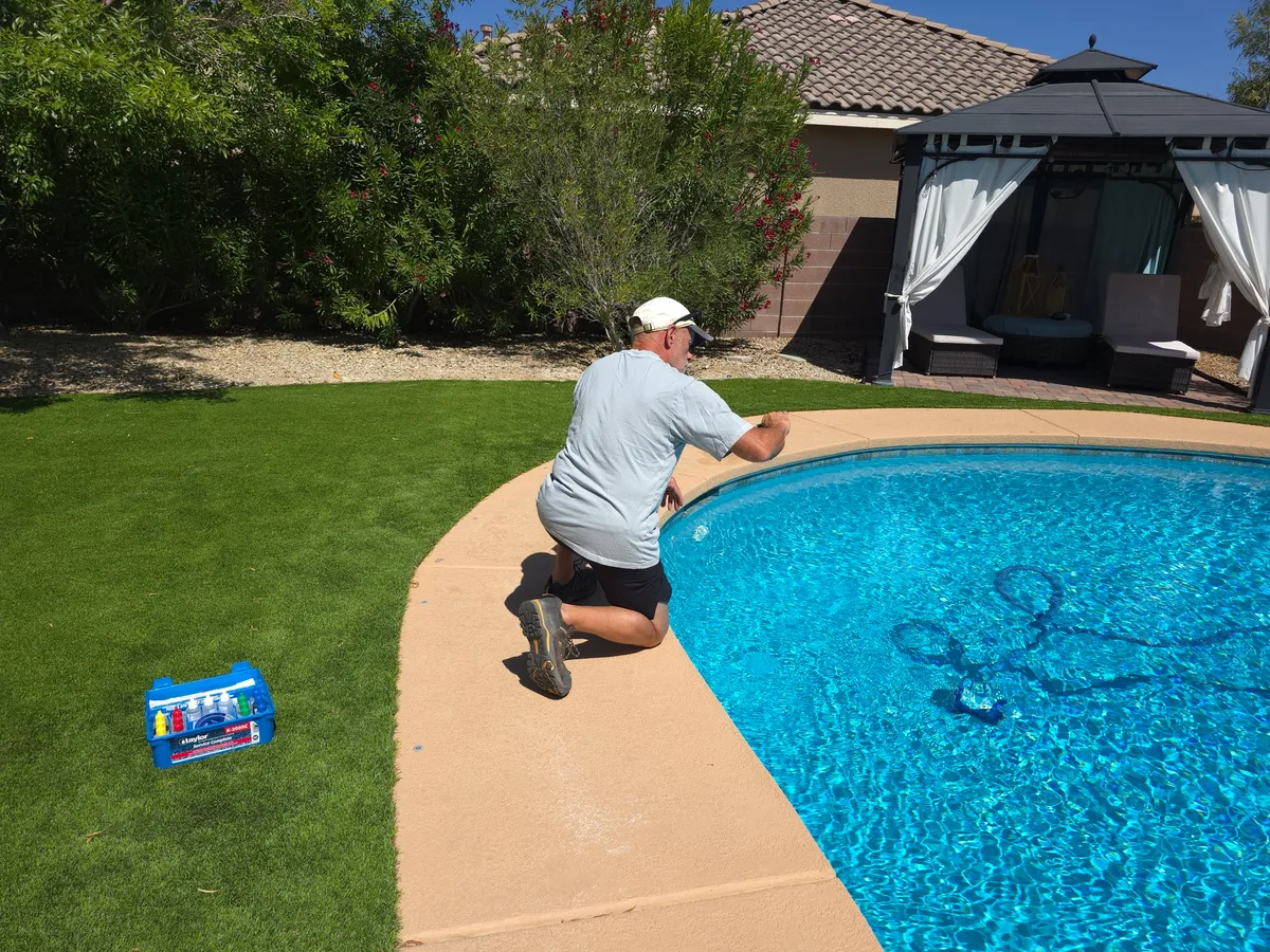 Drop test kit open poolside during a pool service visit
