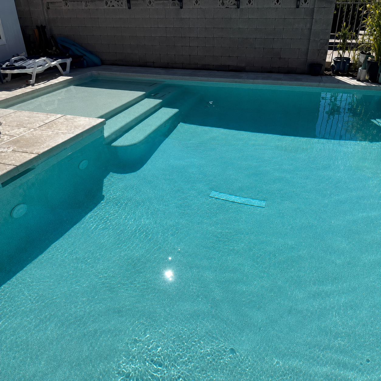 Crystal clear pool water and clean steps after AquaVision Pool Care service